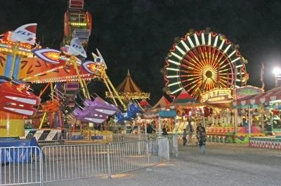 A low resolution picture of a county fair at night
